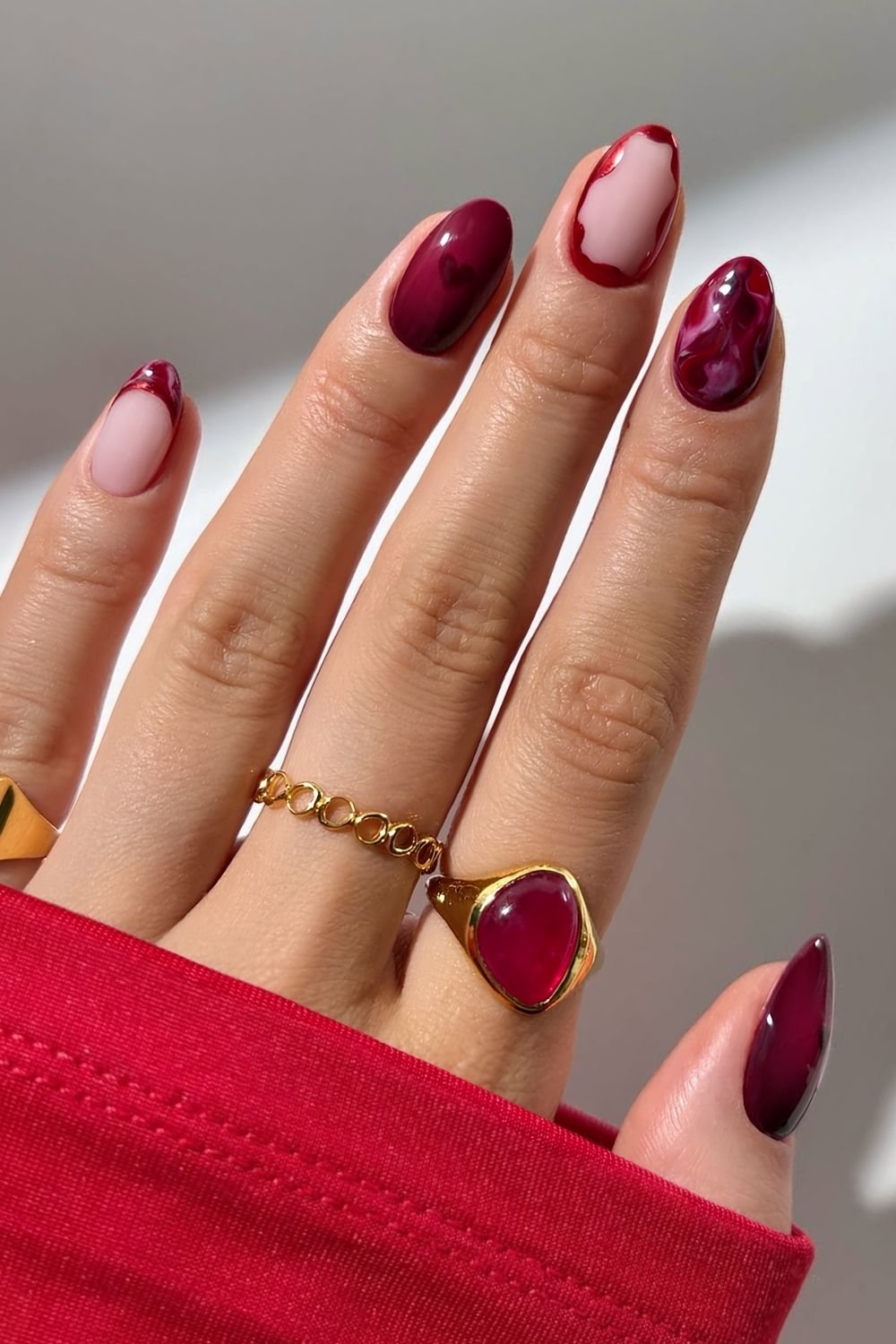 Burgundy marble nails with heart aura accents