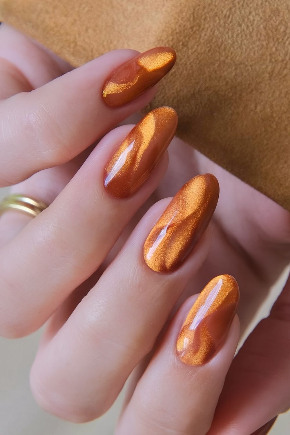Burnt orange cat eye nails