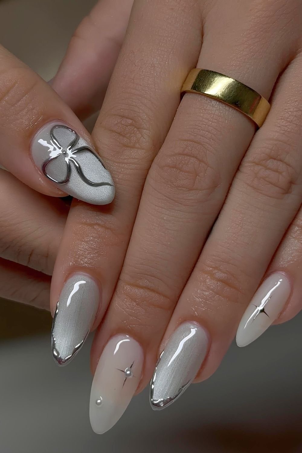 Gray cat eye nail with silver chrome accents