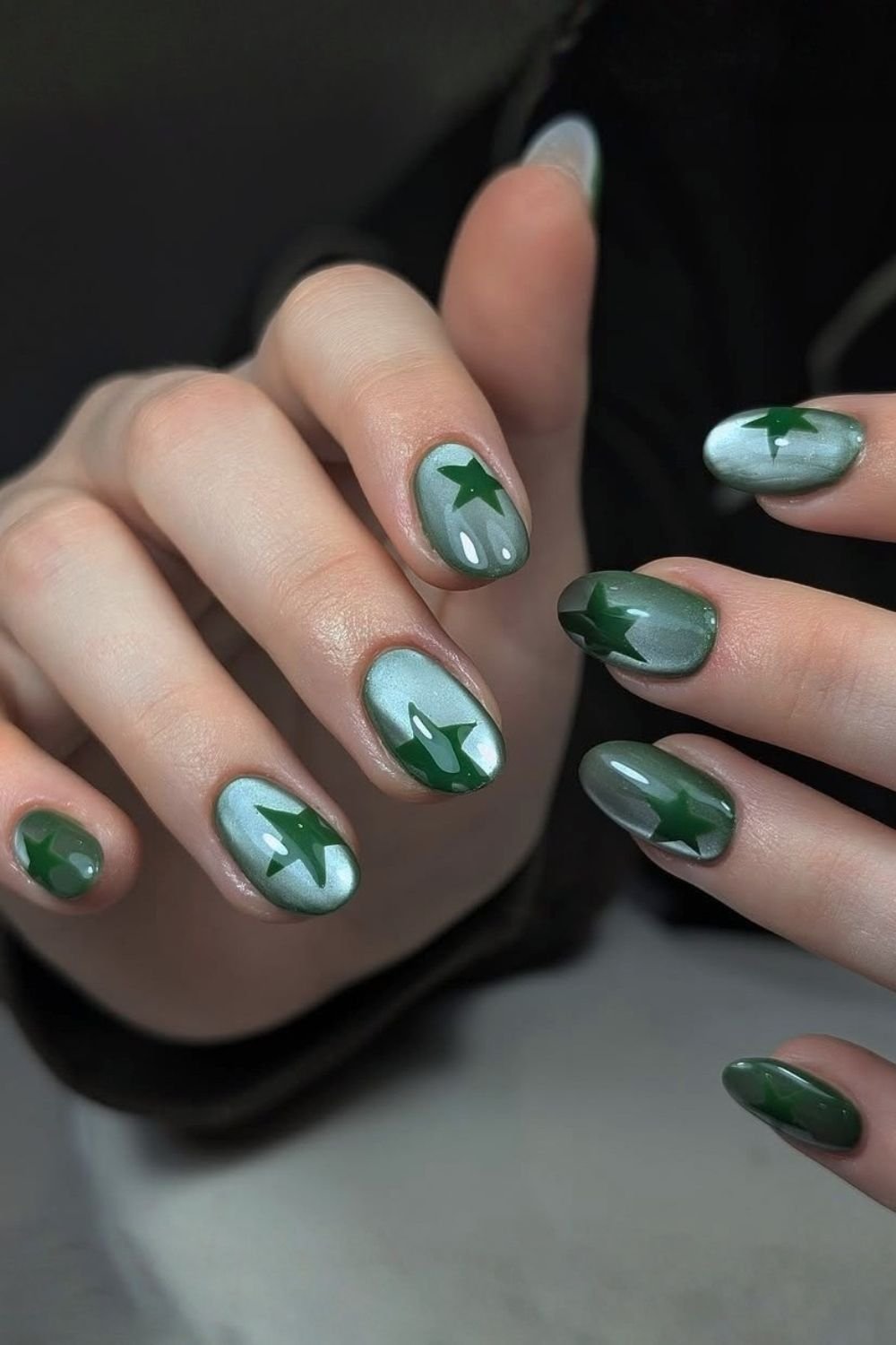 Green cat eye nails with green stars