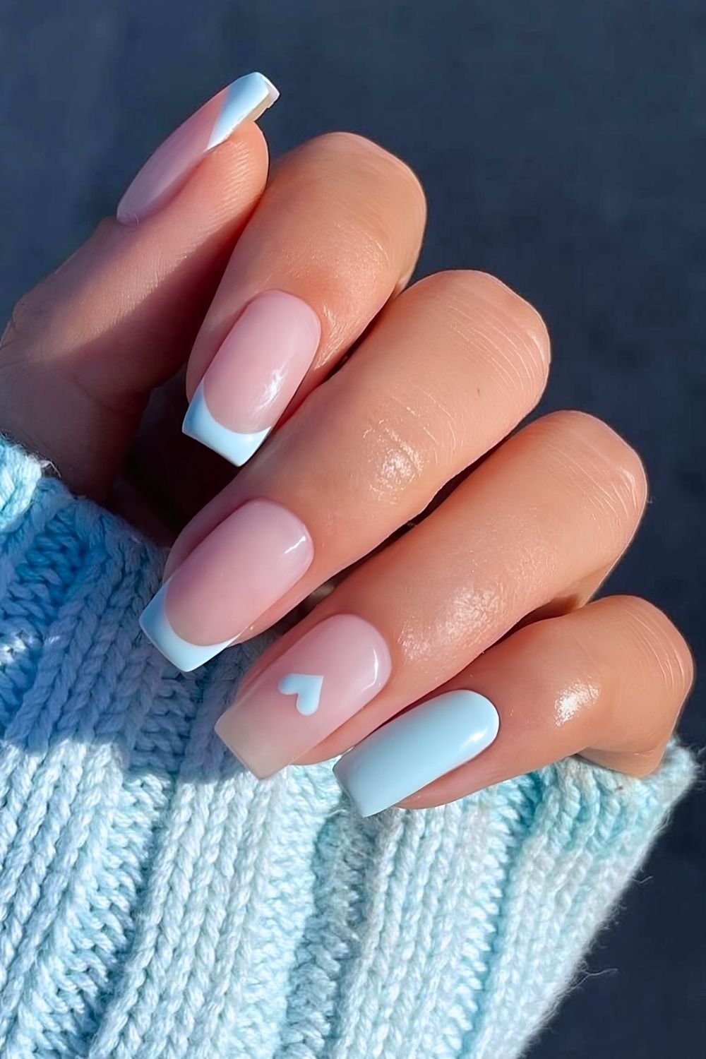 Light blue French nails with heart accent