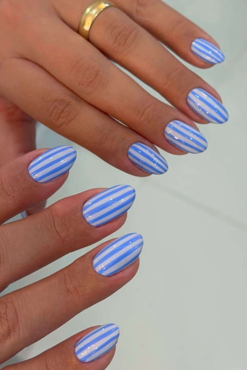 Light blue and white stripes nails