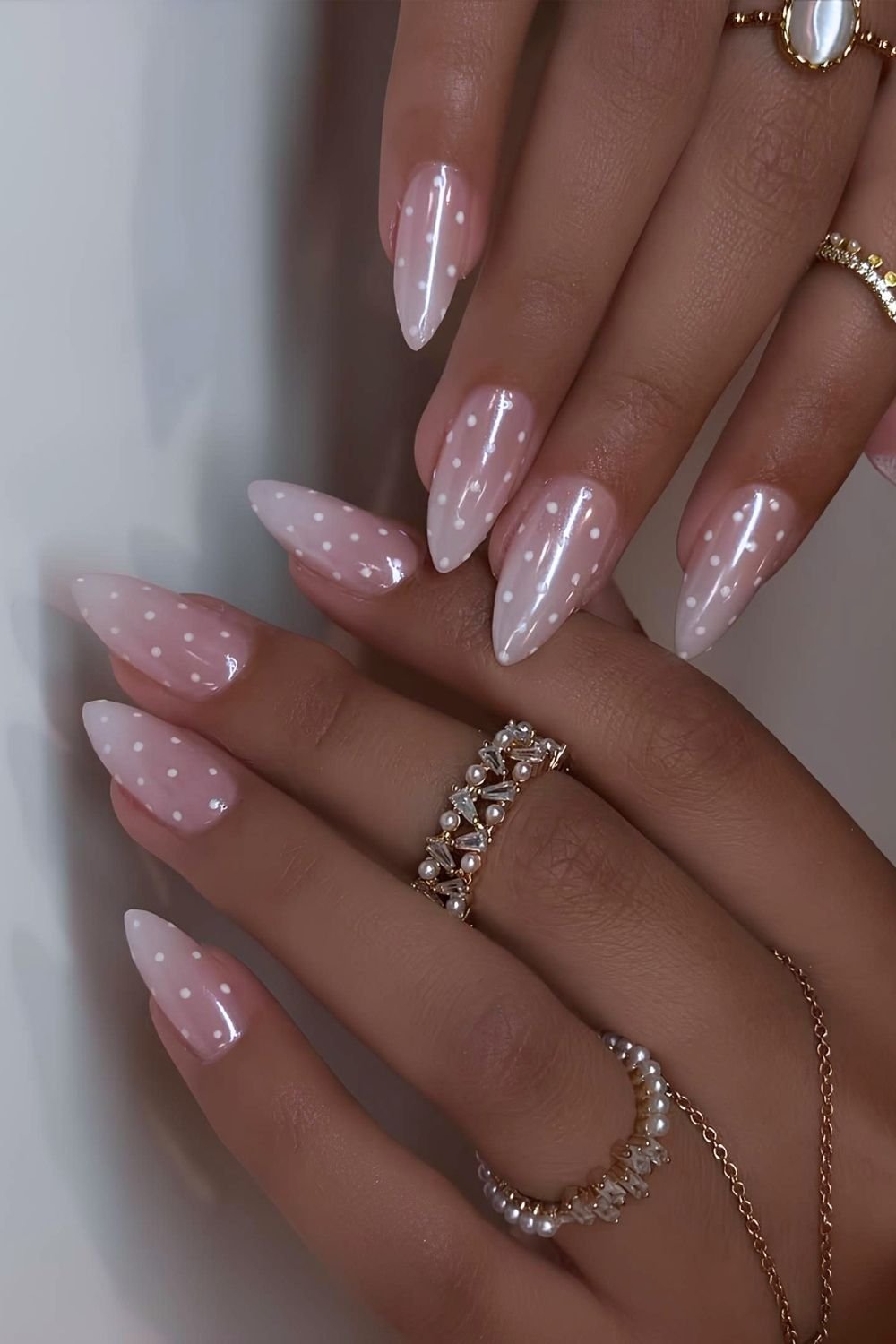 Milky white ombre nails with polka dots