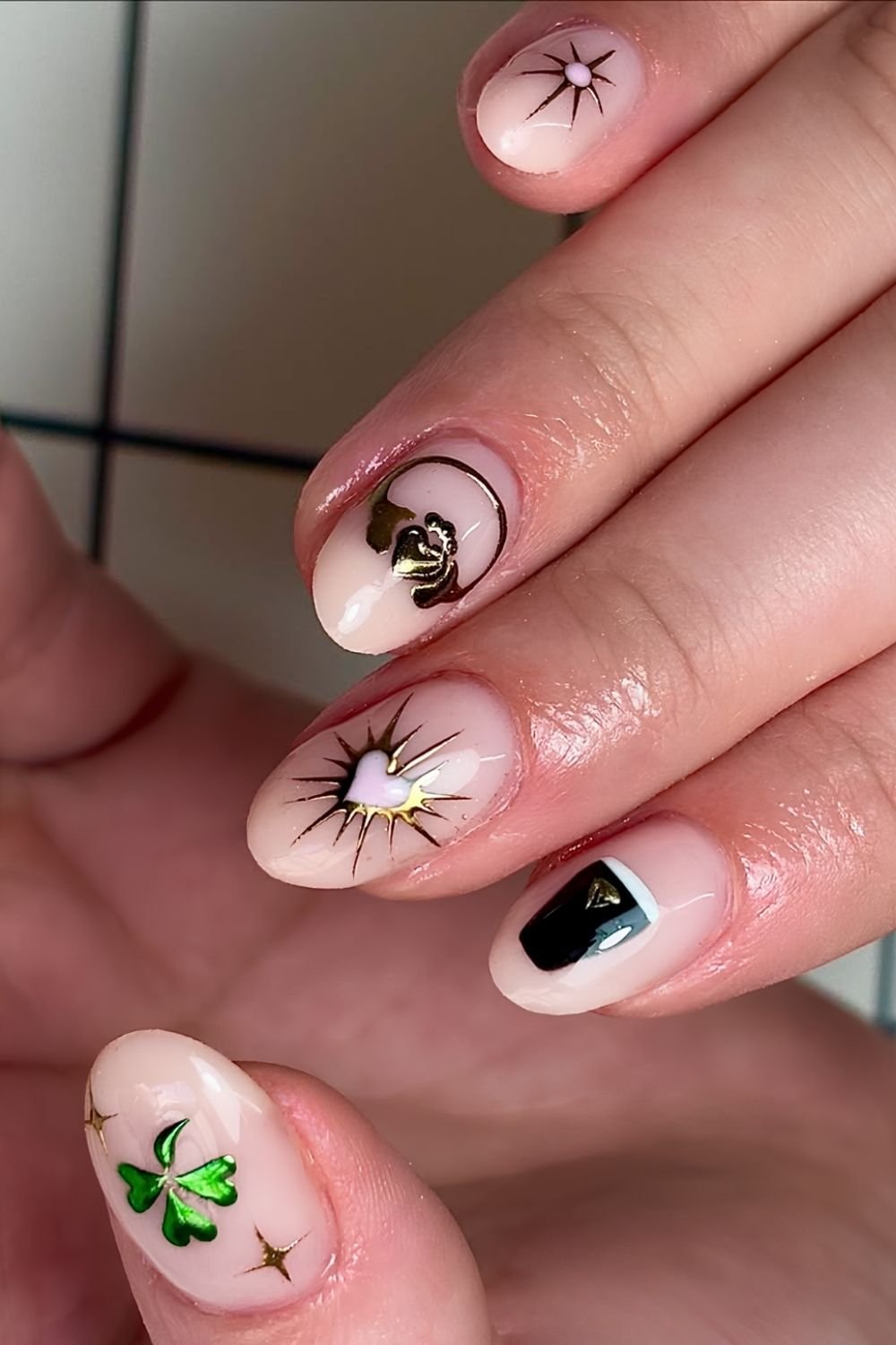 Neutral St. Patrick's day nails with shamrock, guinness,claddagh and heart art