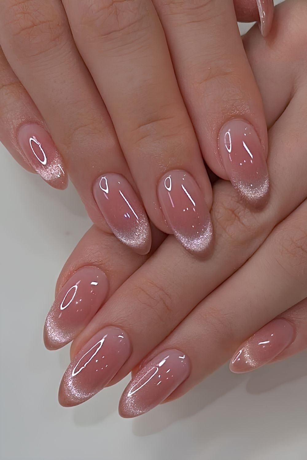 Pink aura nails with cat eye French tips