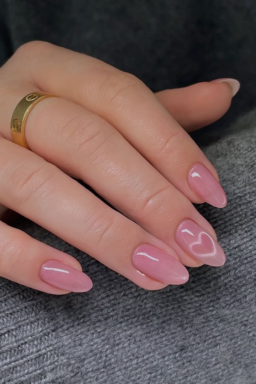Pink cat eye nails with heart acccent