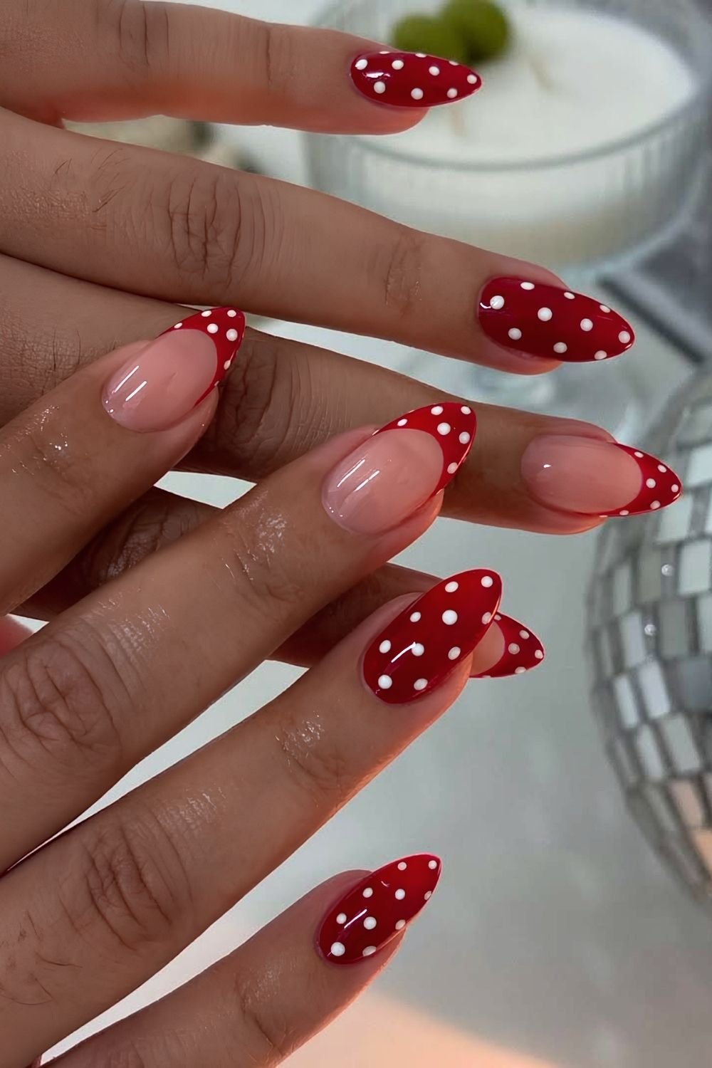 Read and white polka dot nails with French tip accents