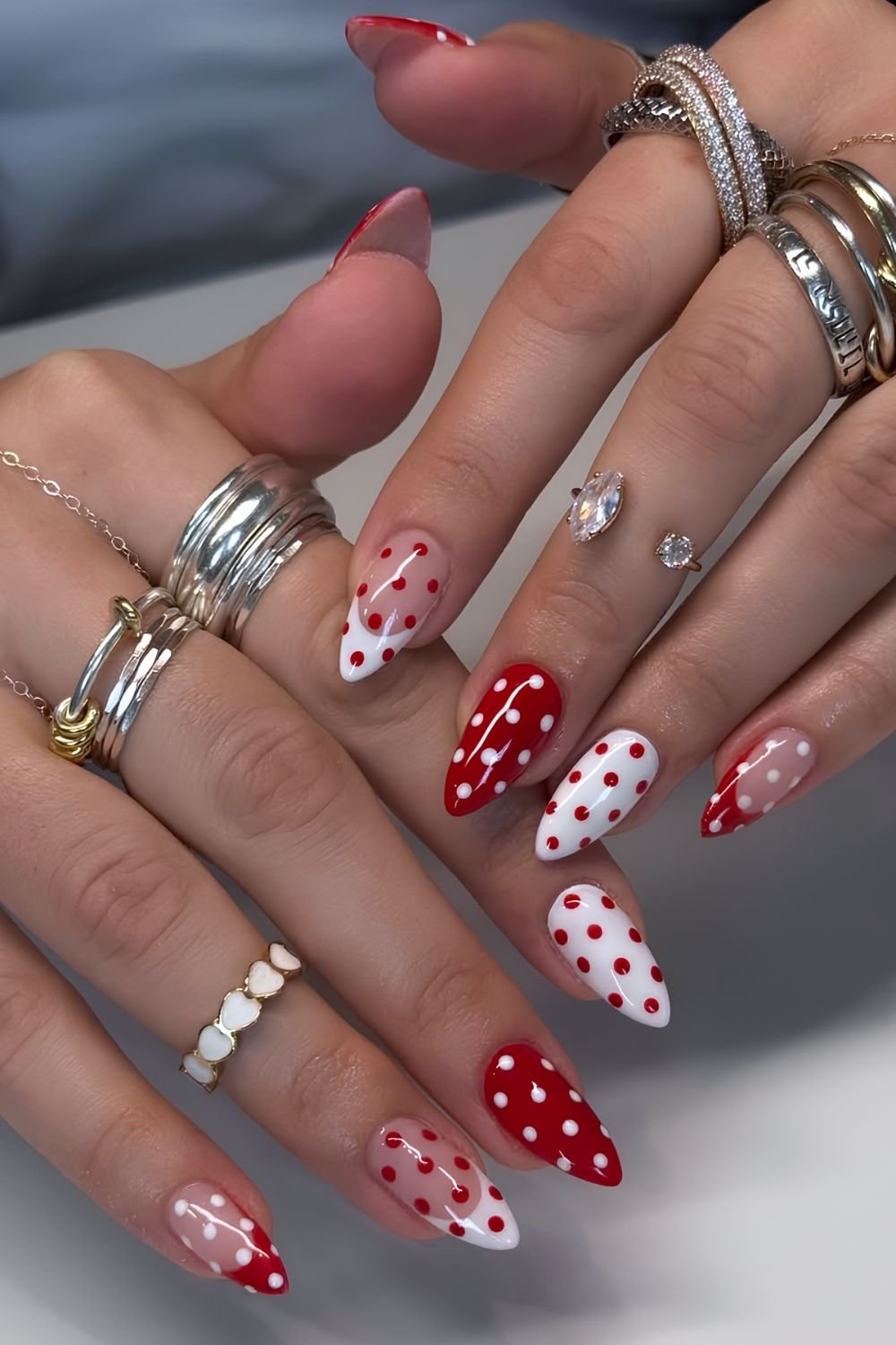 Red and white polka dot nails with French accents