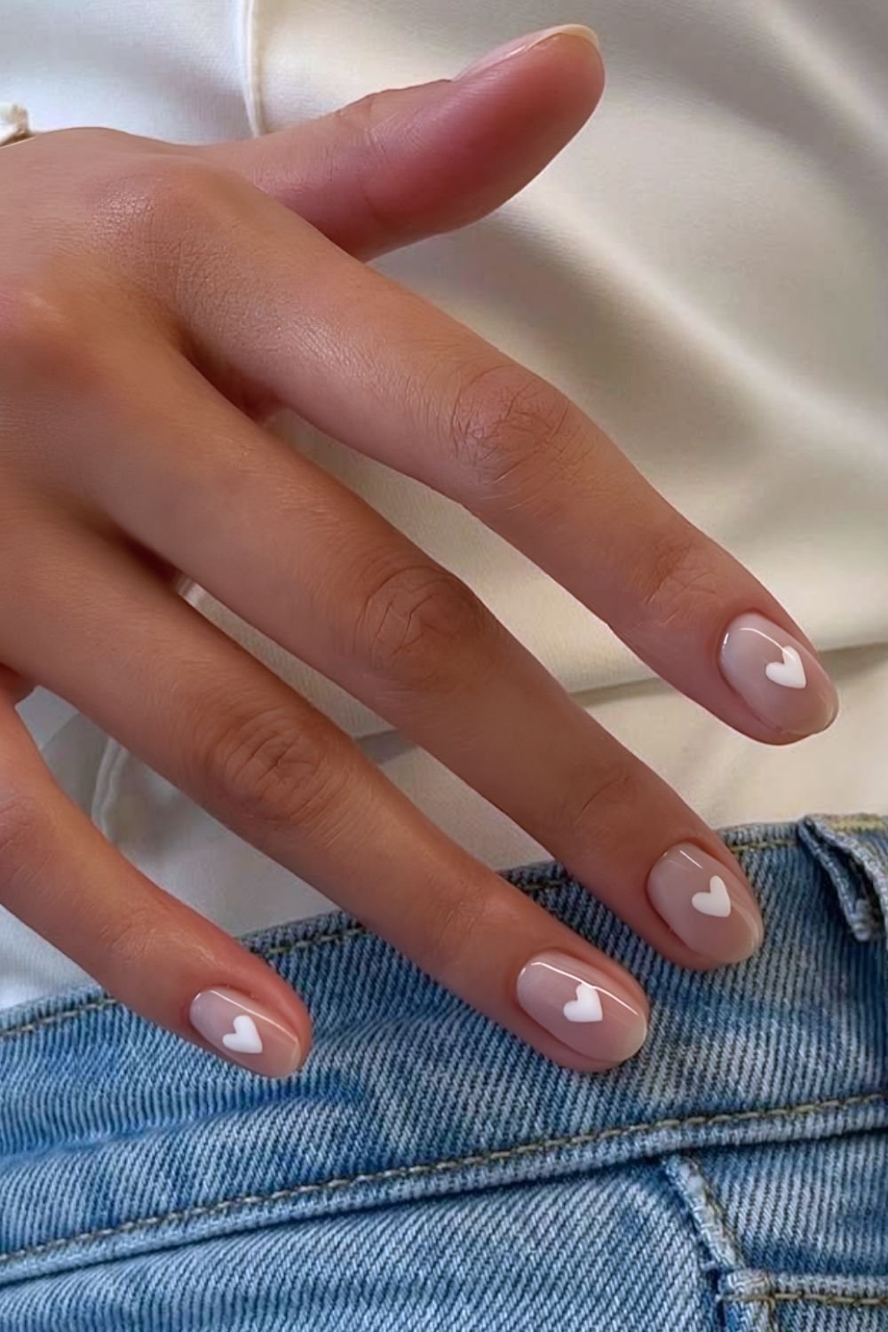 Sheer milky white nails with white hearts
