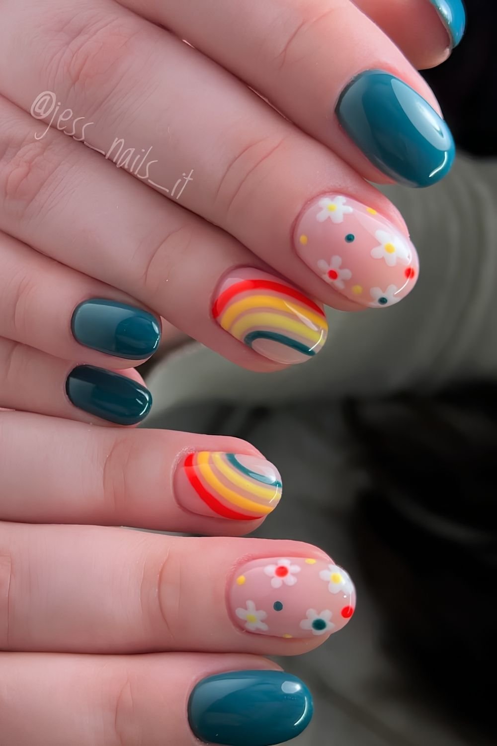 Teal green nails with rainbow and floral accents