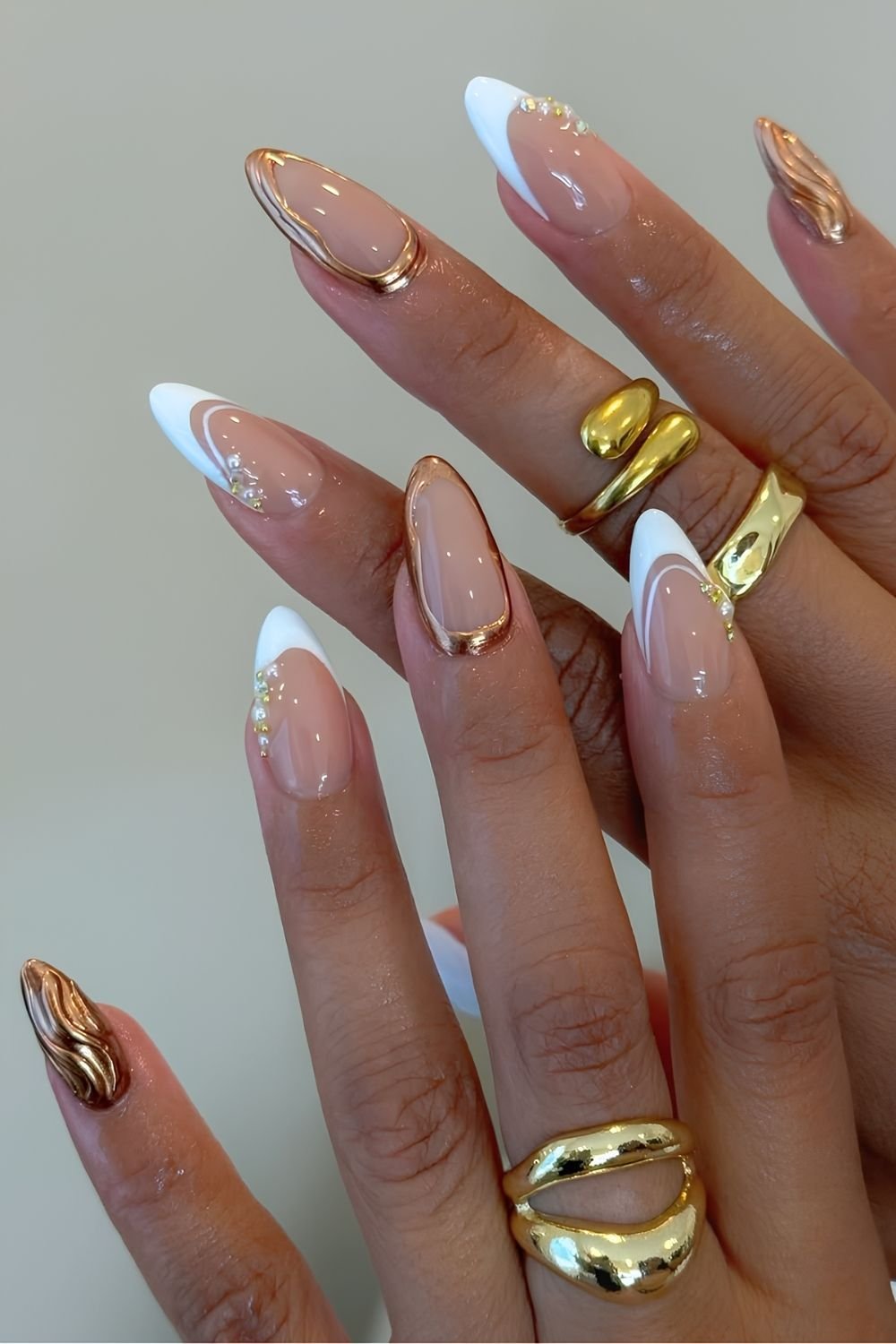 White French tips with gold molten metallic accents