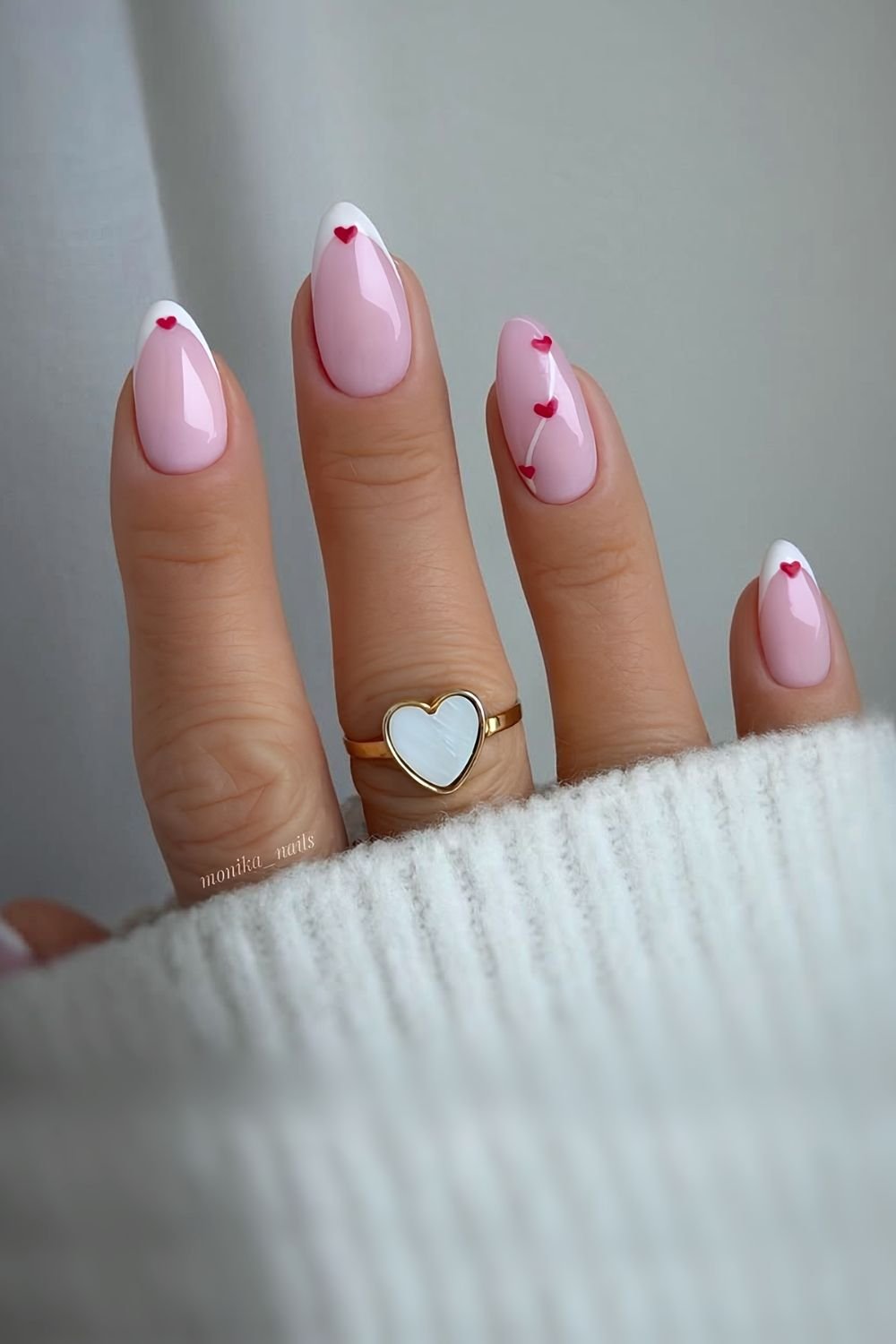 White french manicure with tiny red hearts