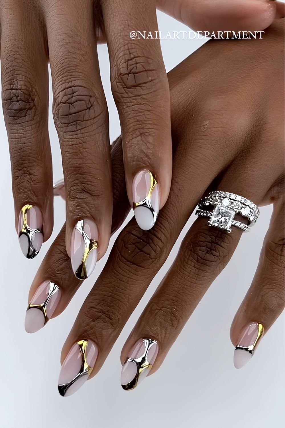 White ombre nails with mixed metal accents