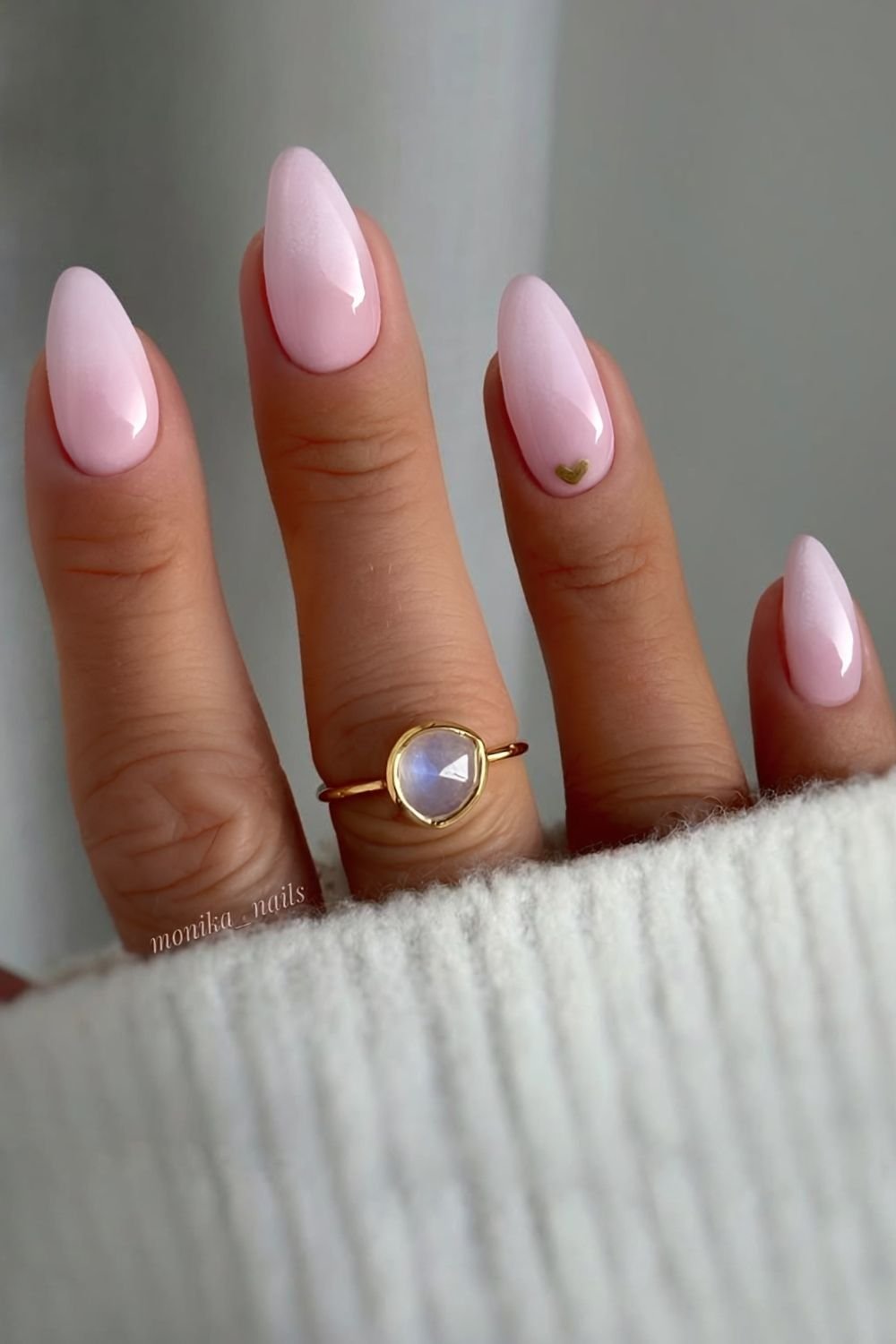 White to pink ombre nails with tiny gold heart accent