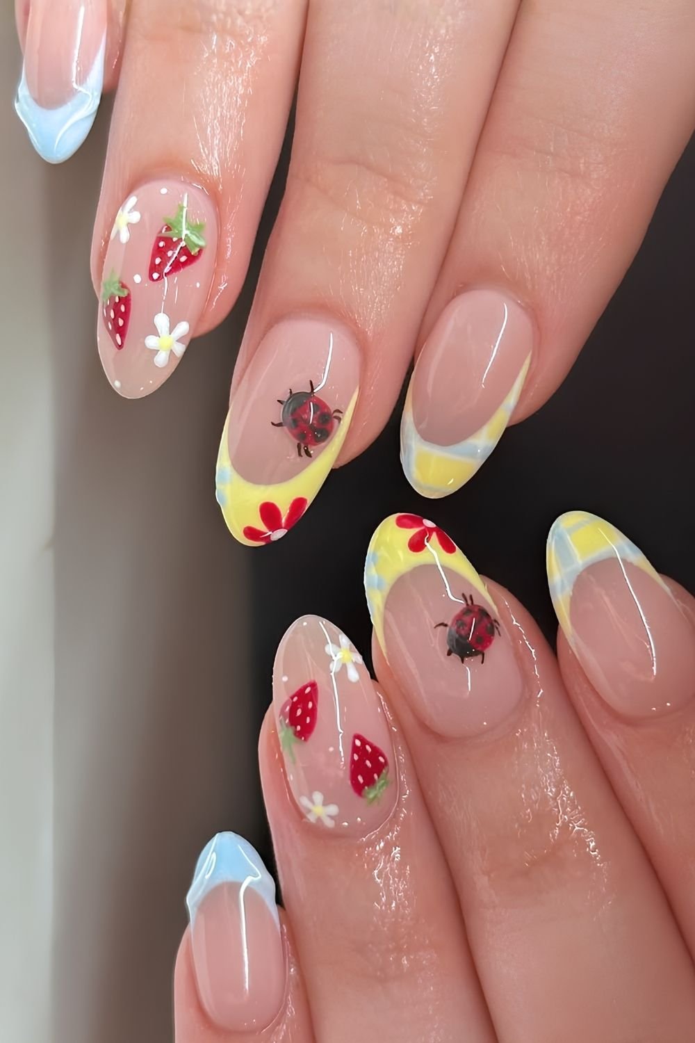 Blue and yellow picnic nails with ladybugs, daisies and strawberries