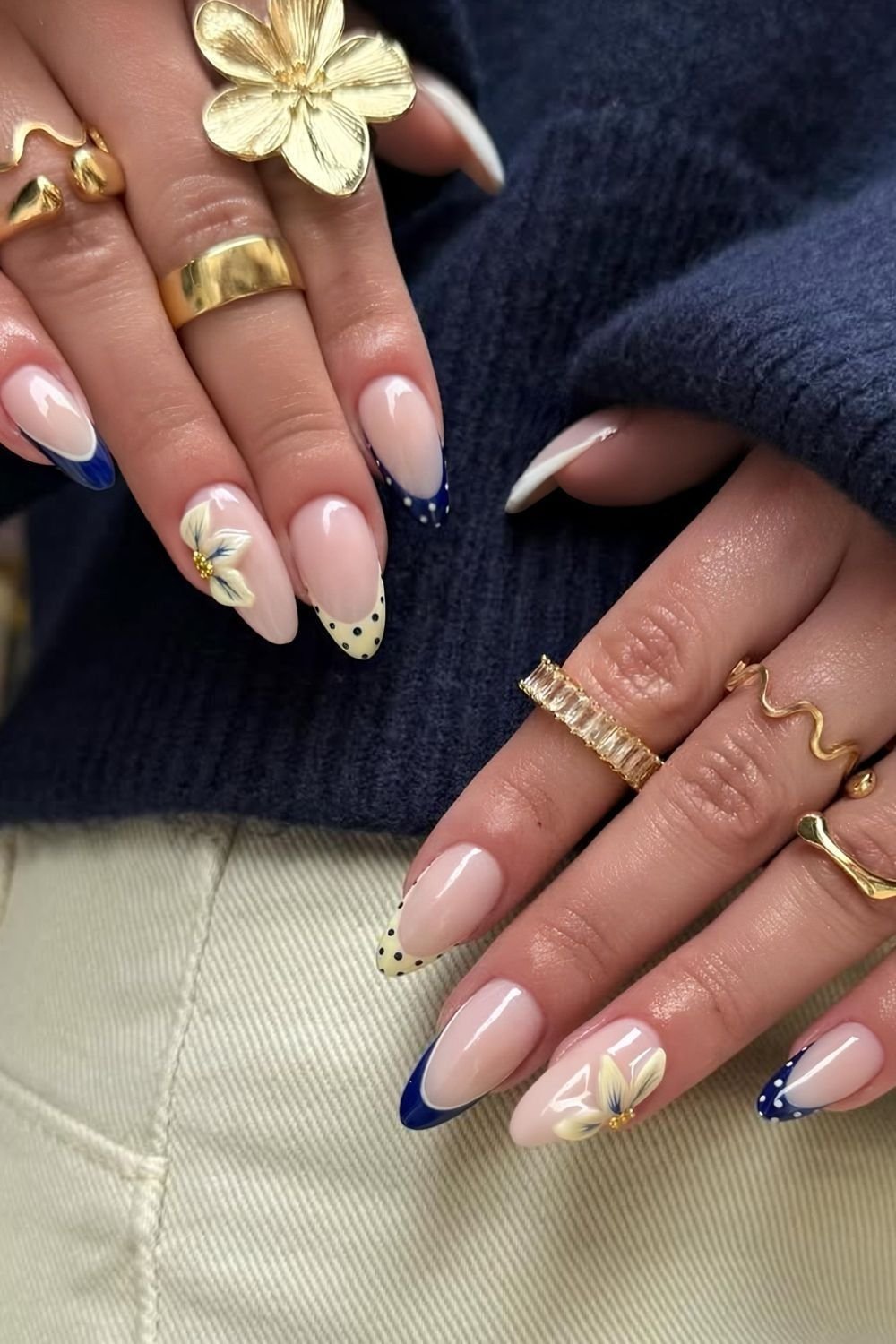 Blue and yellow polka dot French tips with 3D half floral design