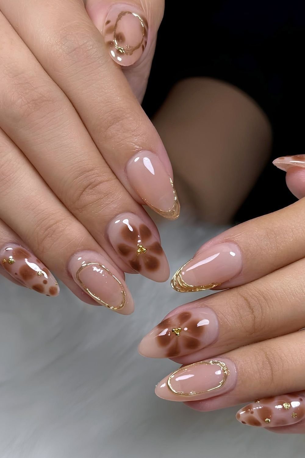 Brown blooming gell florals and leopard design with golden chrome French tips and accents
