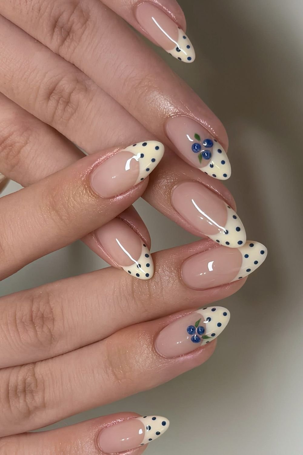 Butter yellow and blue polka dot French tips with blueberrry accents