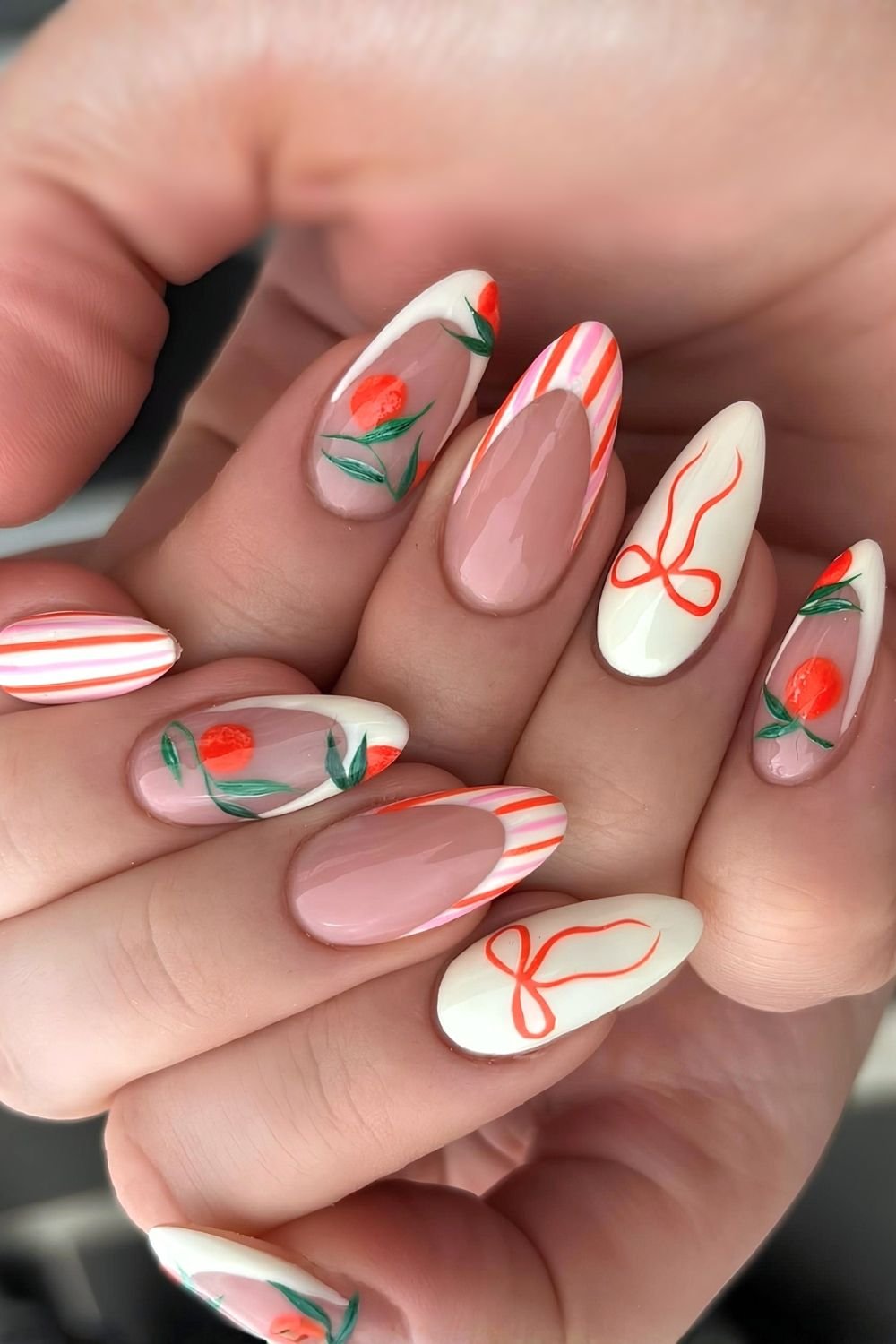 Butter yellow, orange and pink stripes nails with orange fruit and bows