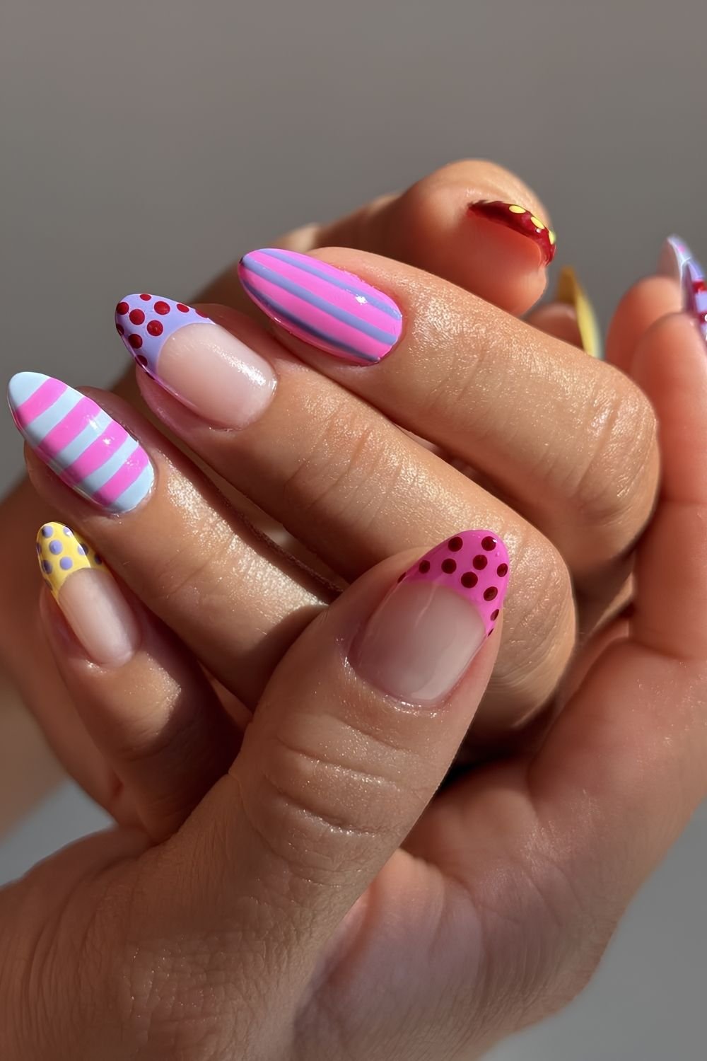 Colorful polka dot and stripes manicure