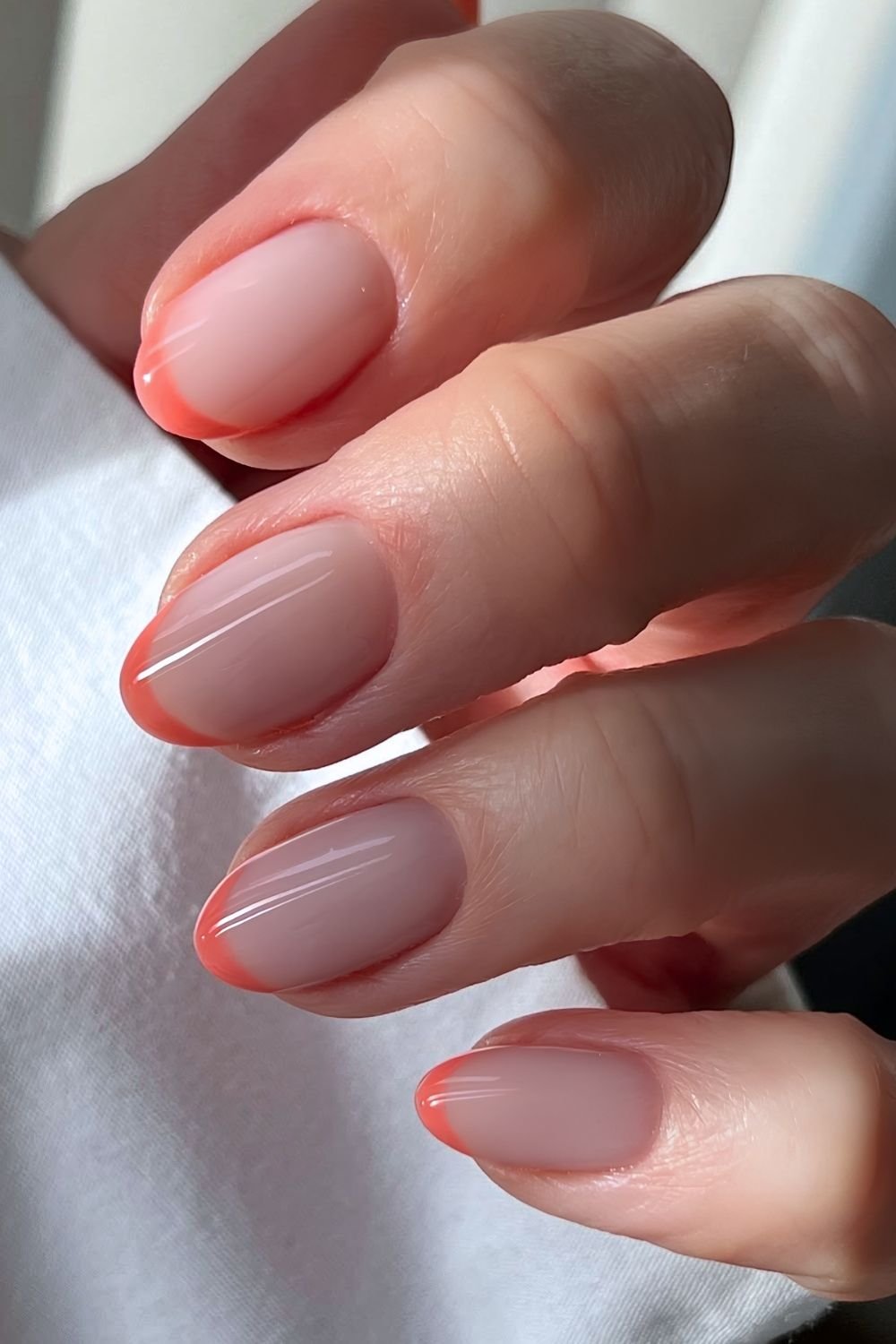 Coral peach French tips in BIAB