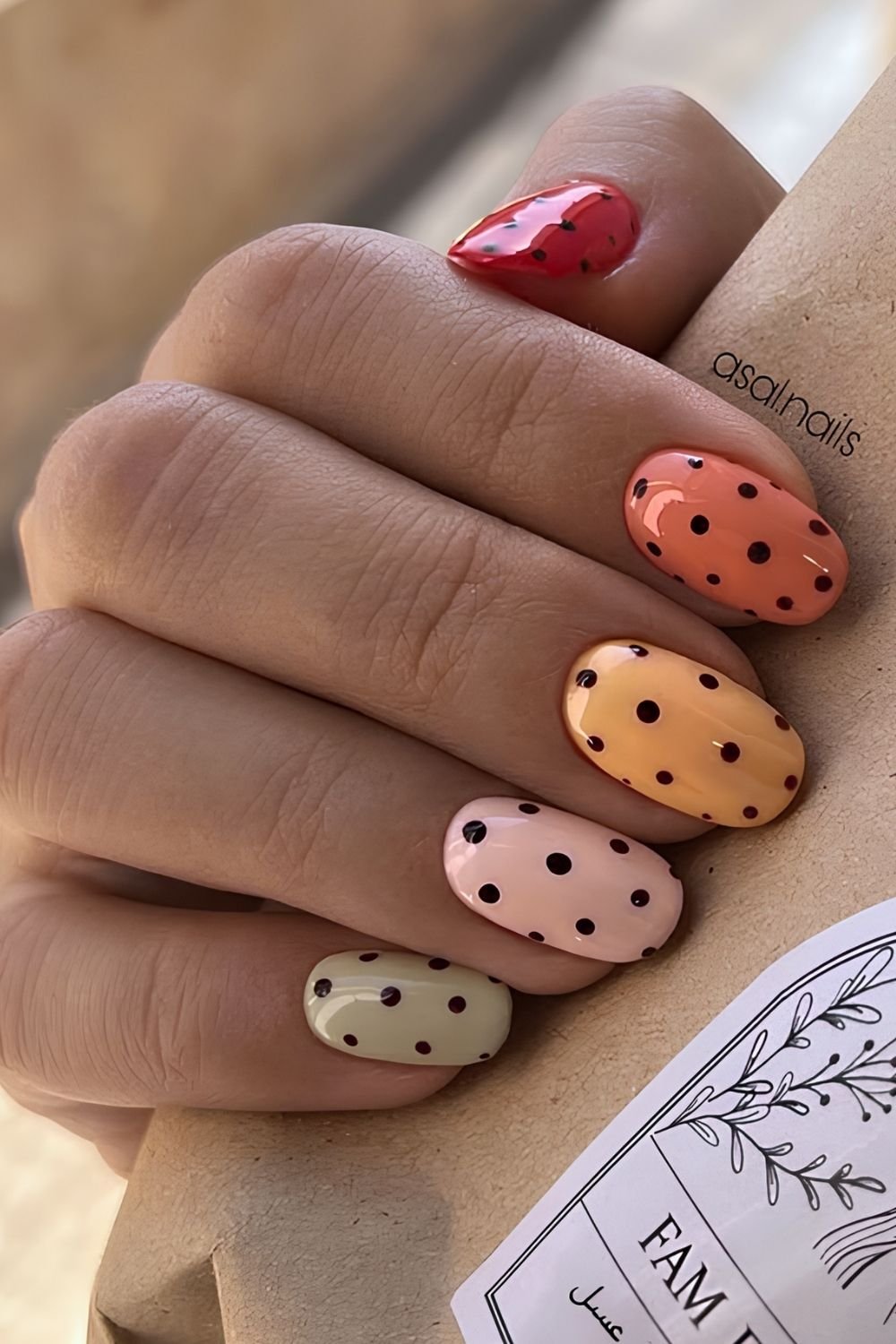 Creamy pastel polka dot skittle nails