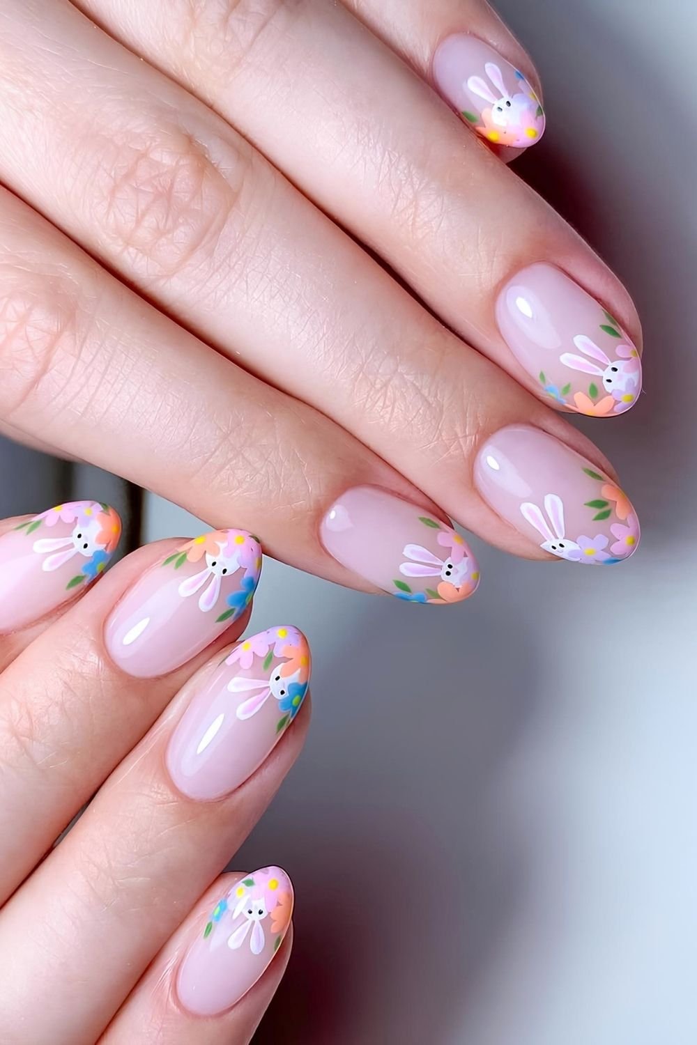 Floral French tip nails with peeking bunnies