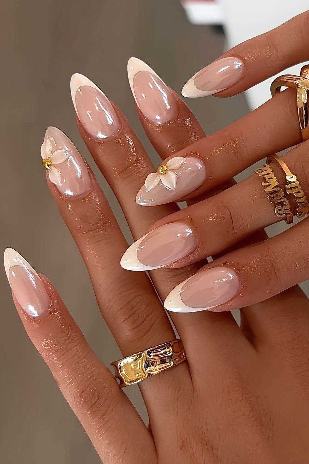 Glazed white french tip with sculpted half floral design