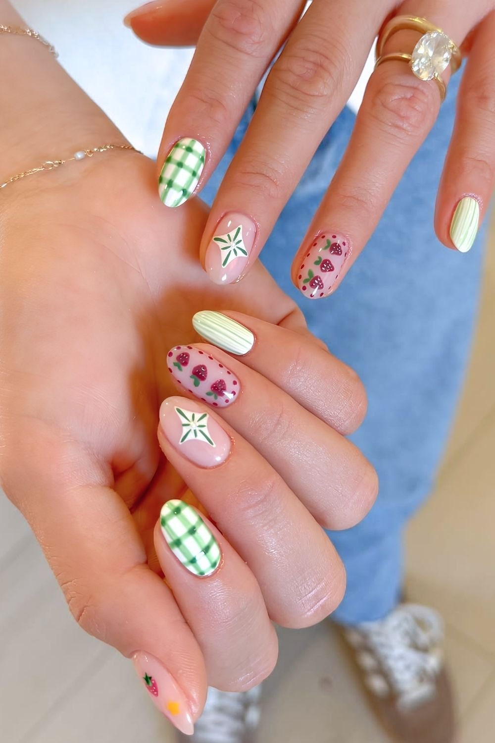 Green gingham and stripe pattern on a white base wit strawberry accent nails