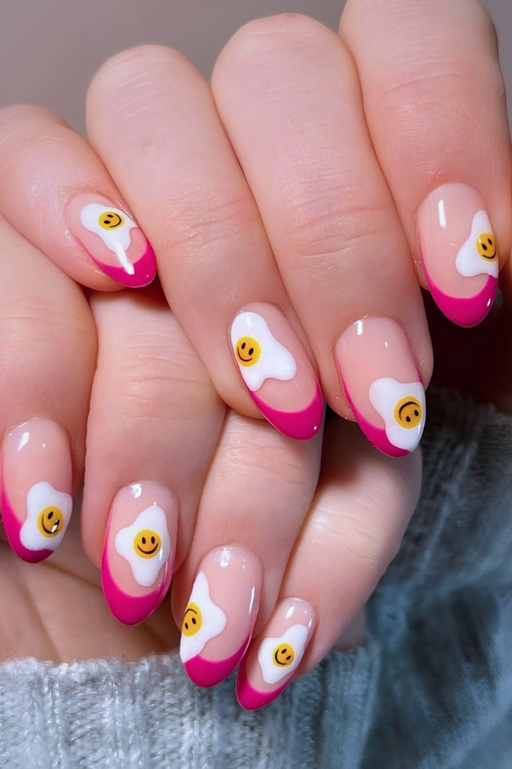 Hot pink French Nails with smiley sunny side up eggs