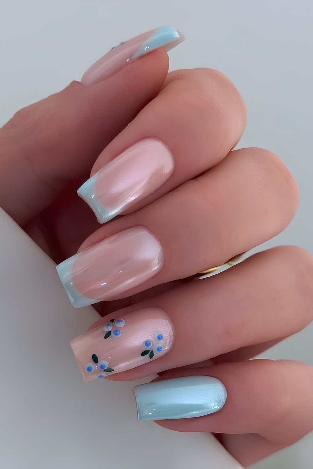 Light blue chrome nails with blueberry accents