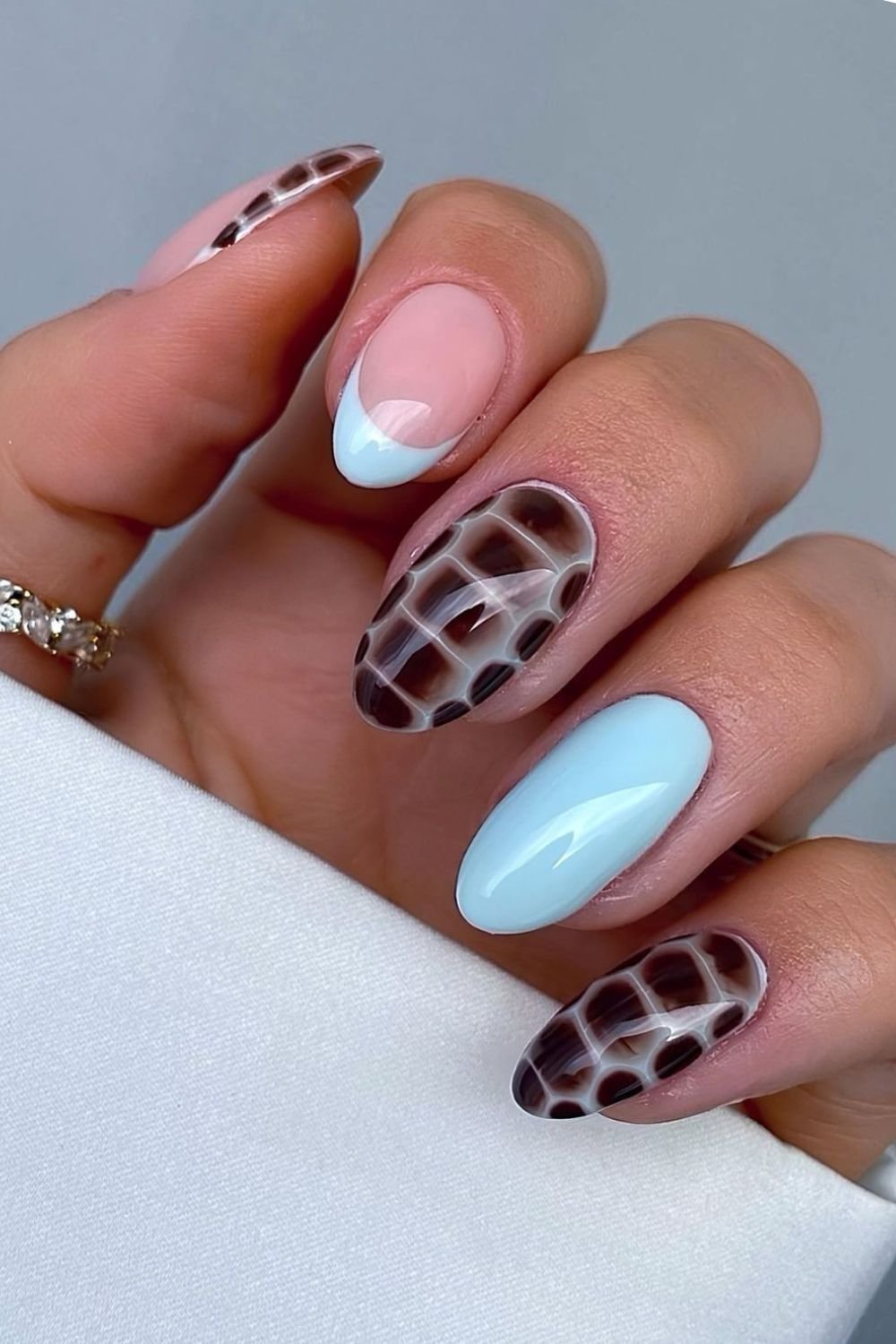 Light blue nails with brown croc print accents