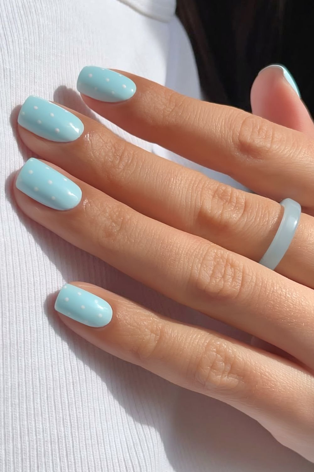 Light blue with white polka dot nails