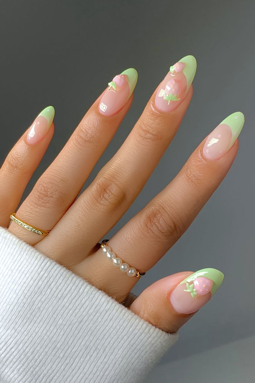 Matcha French tip Nails with pink strawberry and polka dot accents
