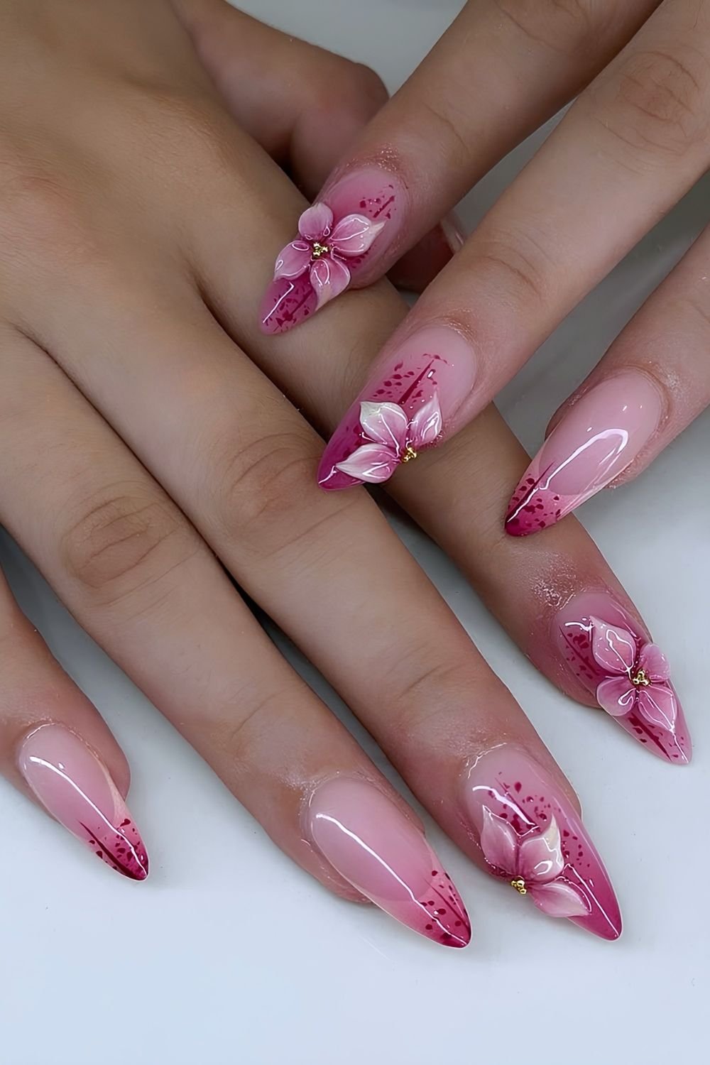 Milky and raspberry pink nails with 3d floral accents