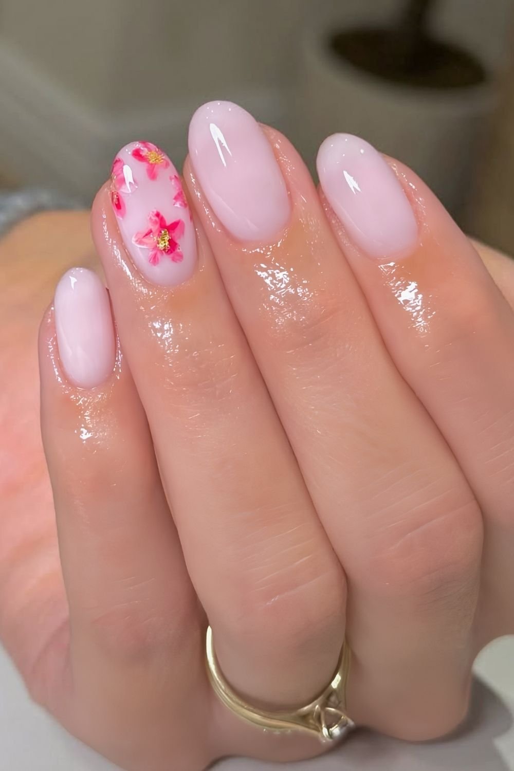 Milky pink nails with hot pink marble flower accents