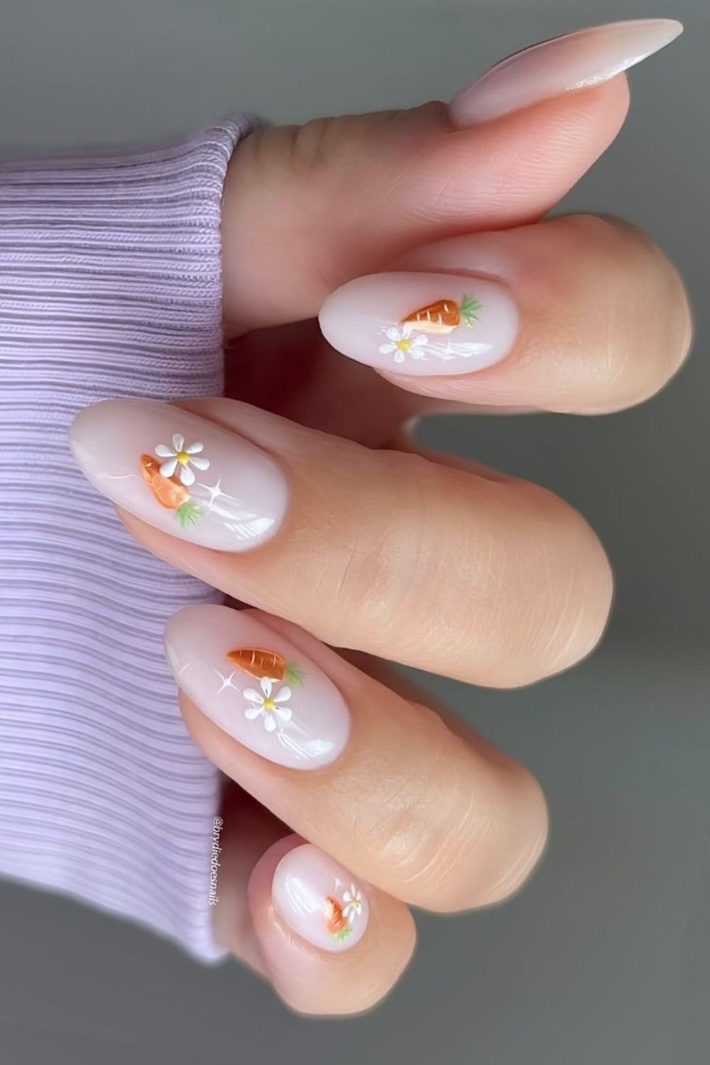 Milky white nails with orange chrome carrots and daisies