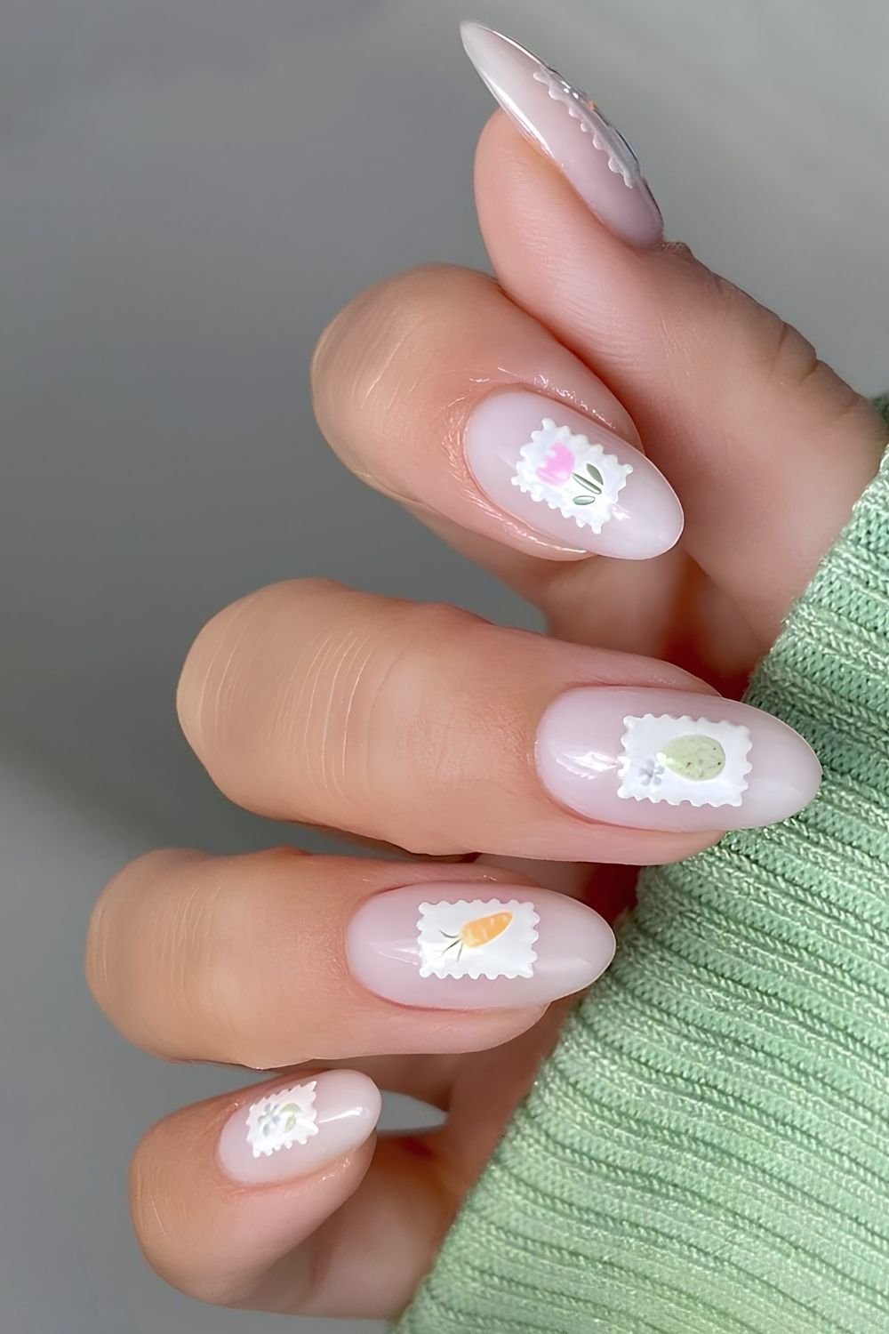 Neutral milky nails with Easter motive stamp art