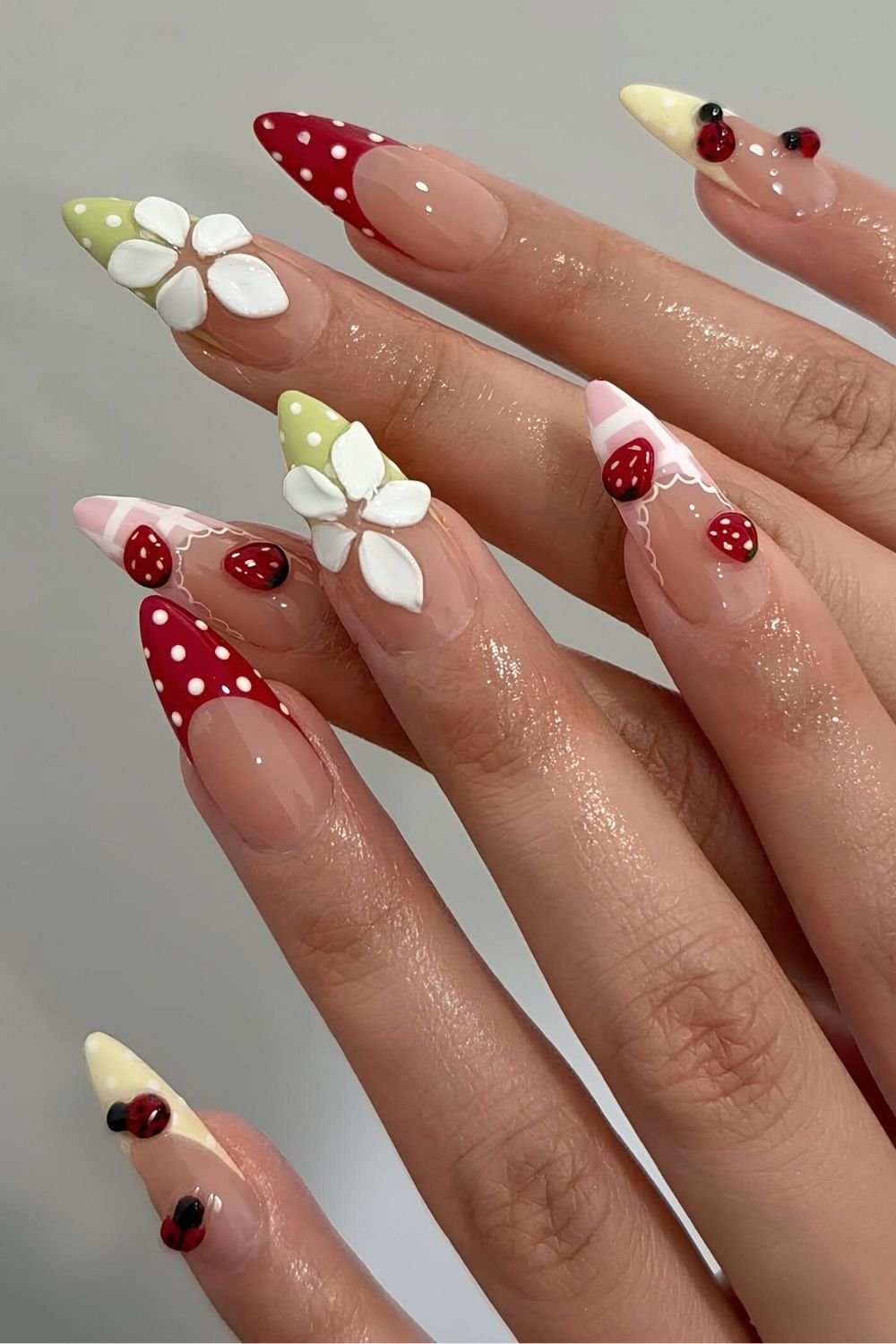 Picnic inspired nails with ladybugs, strawberries and gingham
