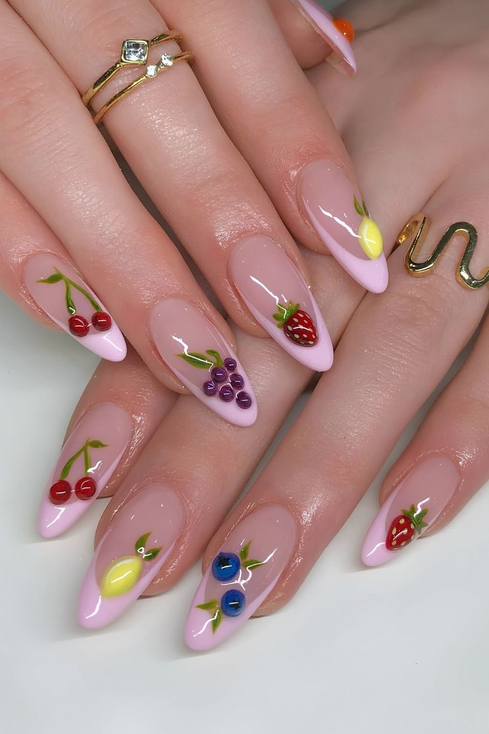 Pink French tip nails with 3D Fruit accents