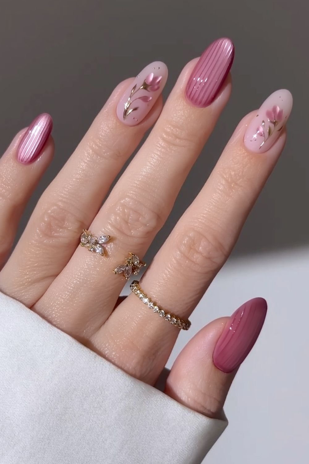 Pink ribbed glass nails with floral accents