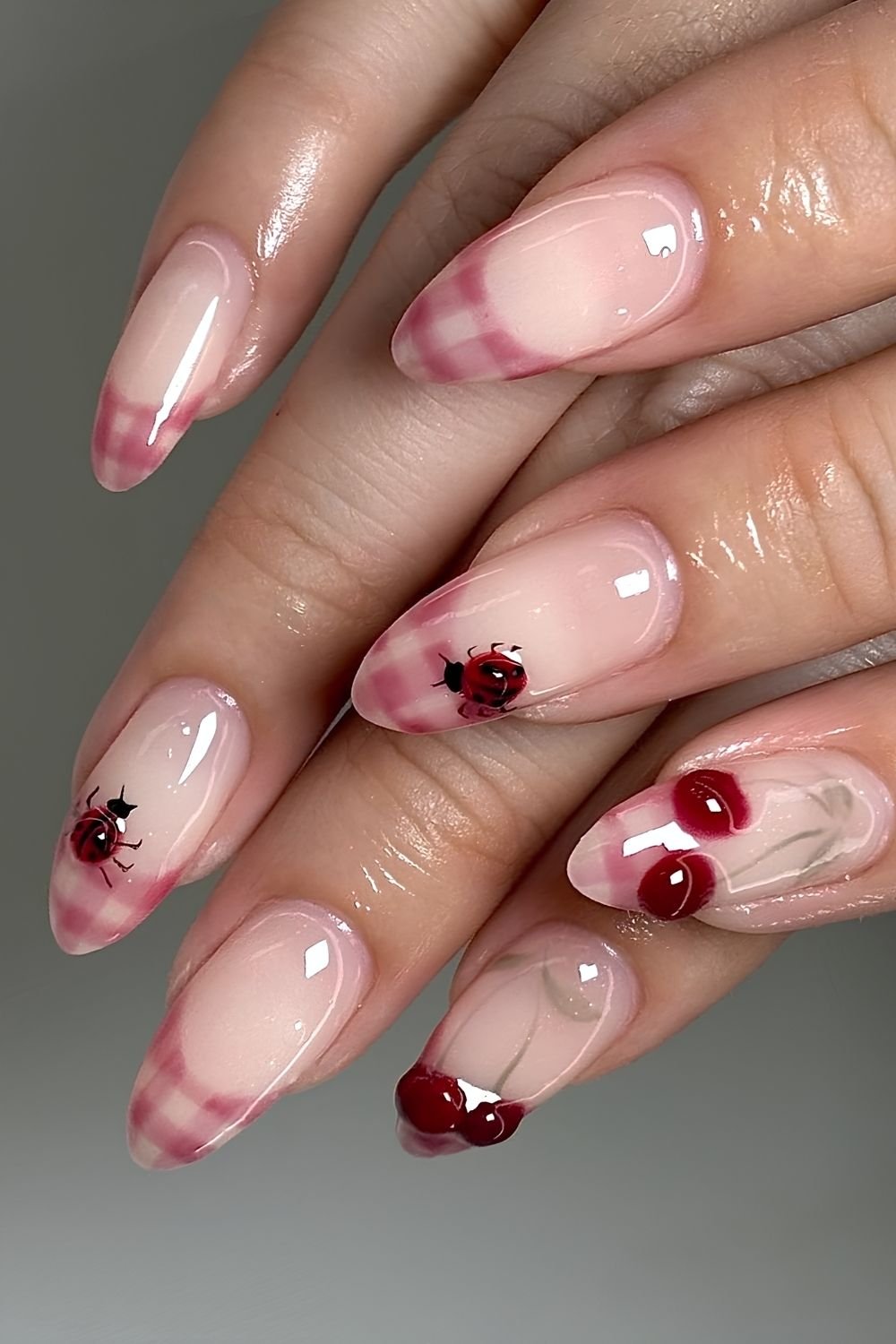 Red gingham french tips with 3D ladybugs and cherry accents