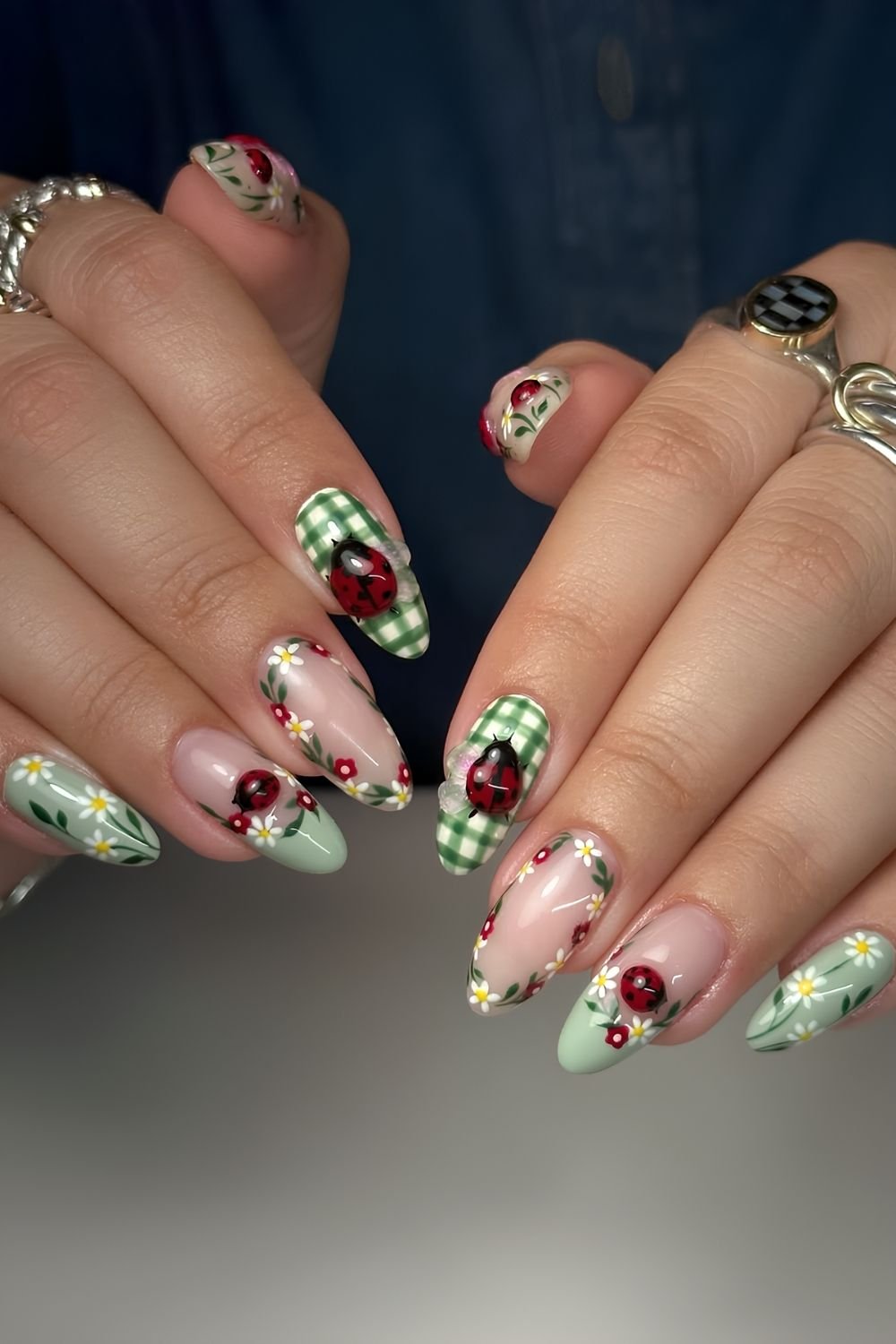Sage and dark green nails with florals and 3D ladybugs
