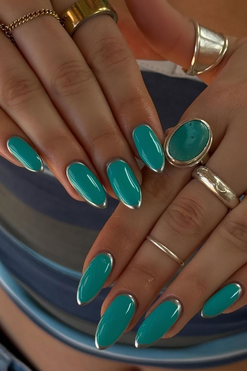 Teal green nails with silver chrome upside down French tip nails