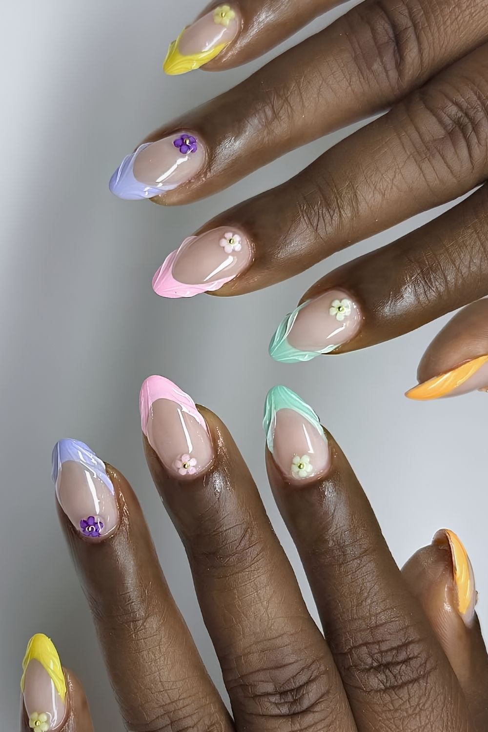 Textured pastel skittle French tips with 3 d cuffflorals