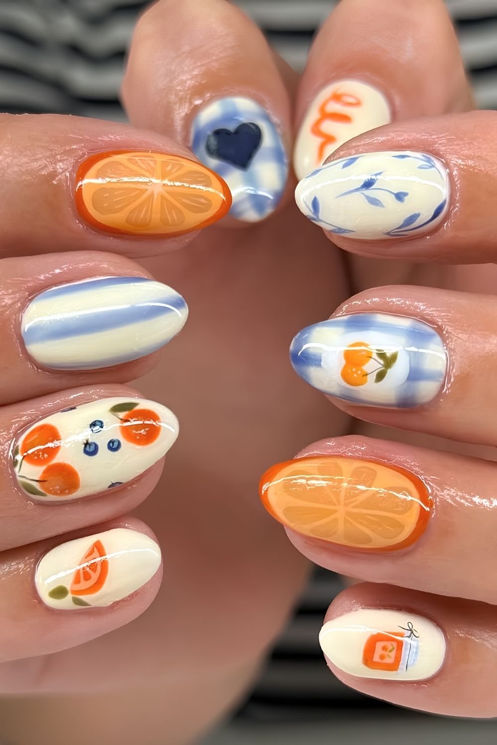 White and blue nails with jelly orange slice accents
