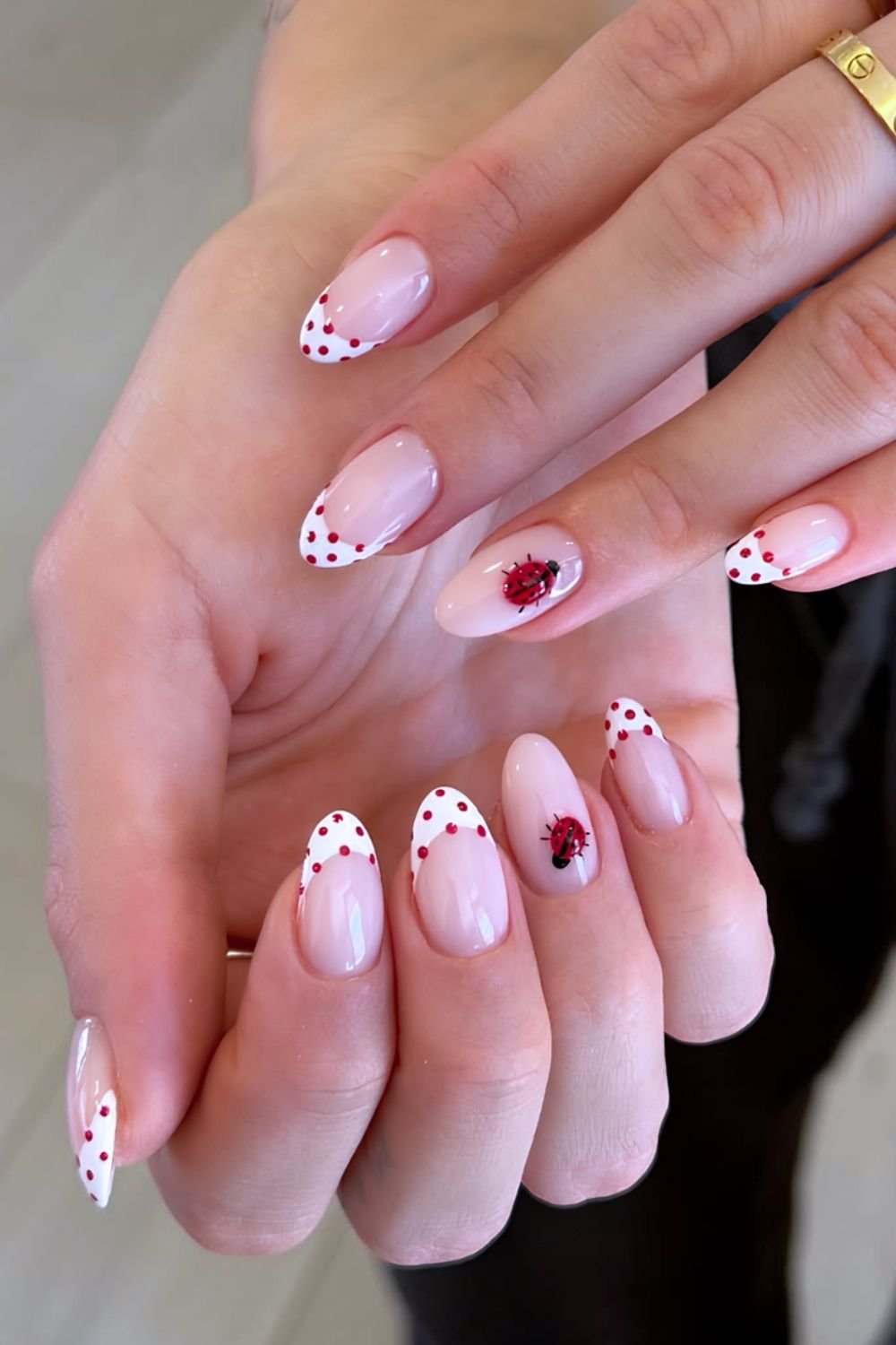White and red polka dot French tips with ladybug accents