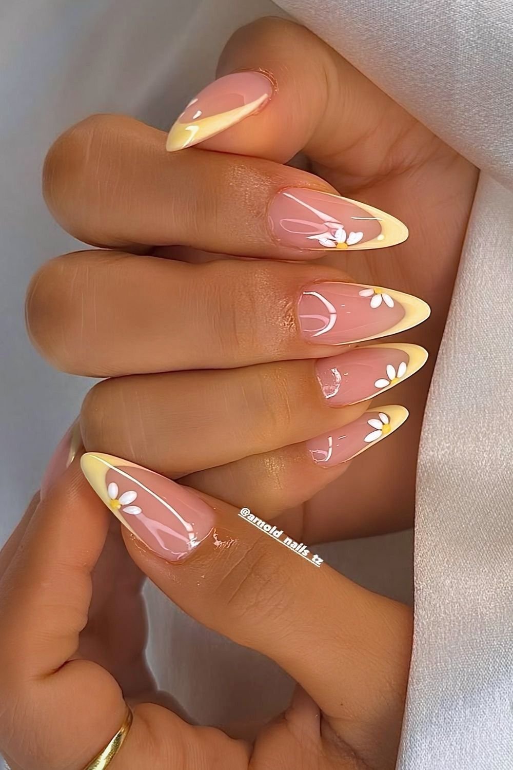 Yellow french tips with white daisy nail art