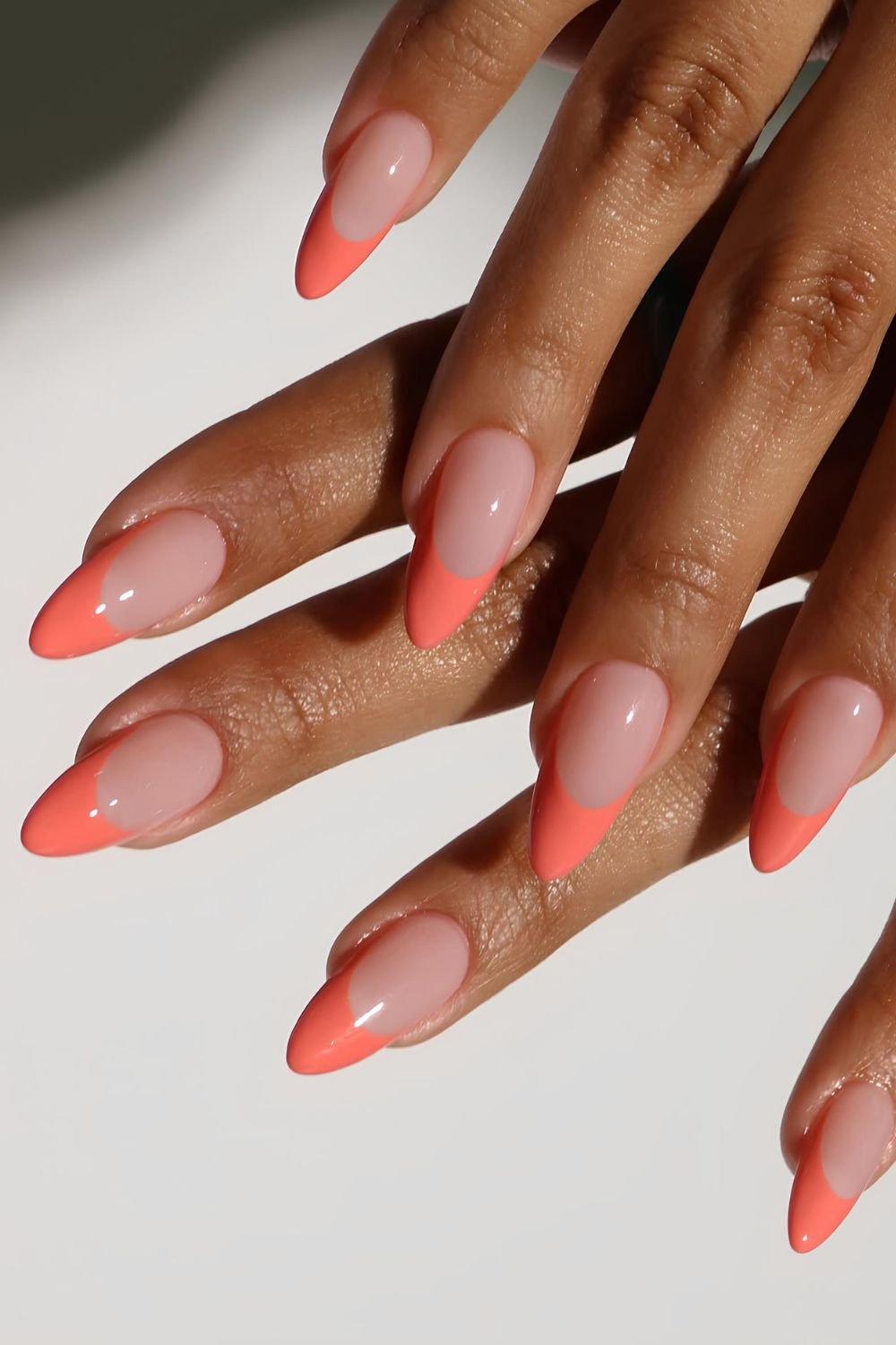 Almond shaped coral French nails
