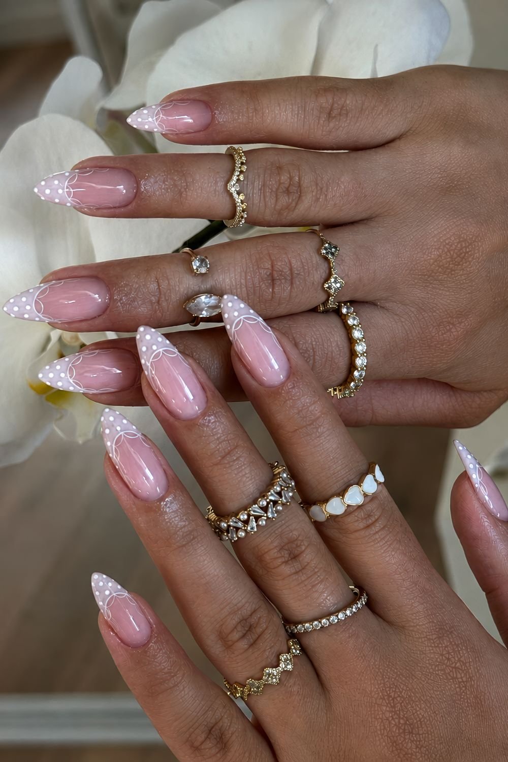 Beige white polka dot French nails with lace outline
